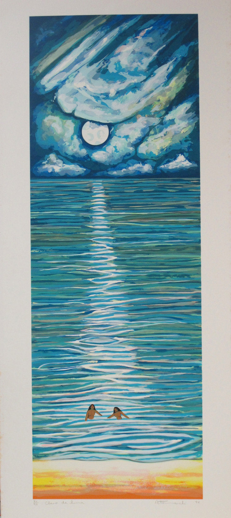 Vertical composition of a seashore at nightime. The moon reflects on the water while two women stand in the water