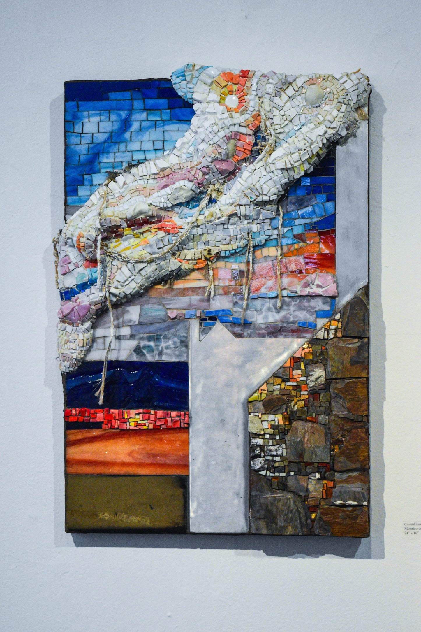 Mosaic artwork of sunset and stone wall with textured elemets