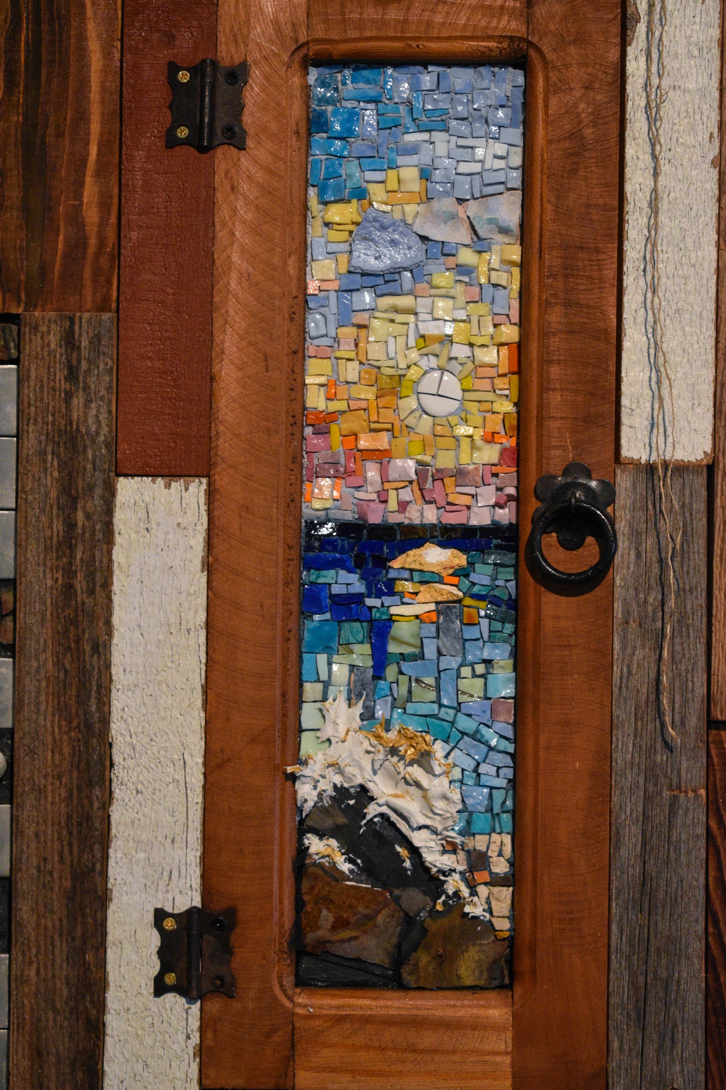 Mosaic artwork of window overlooking the sea