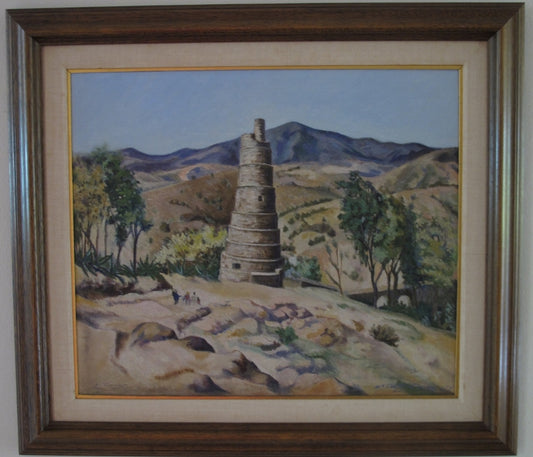 A framed oil on canvas painting depicting a mountainous landscape with a large, cylindrical structure, in the foreground.