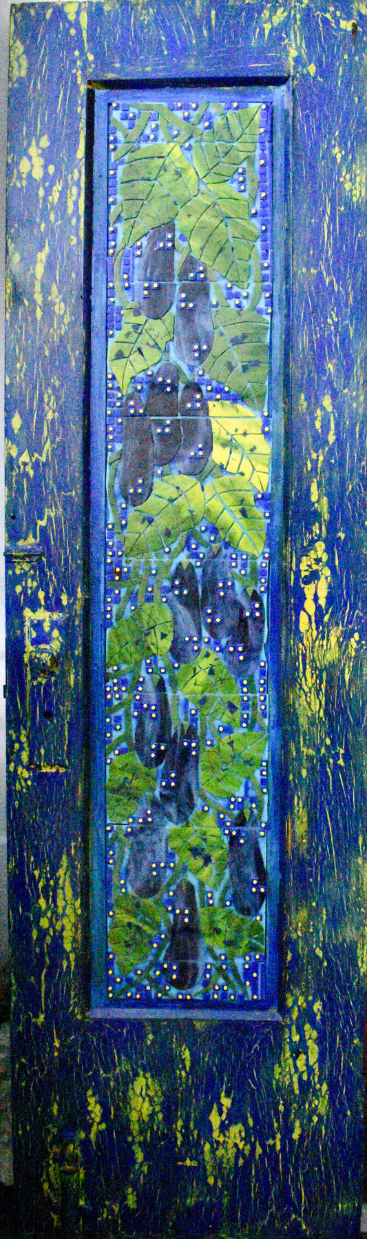 Decorative door with blue and green mosaic design