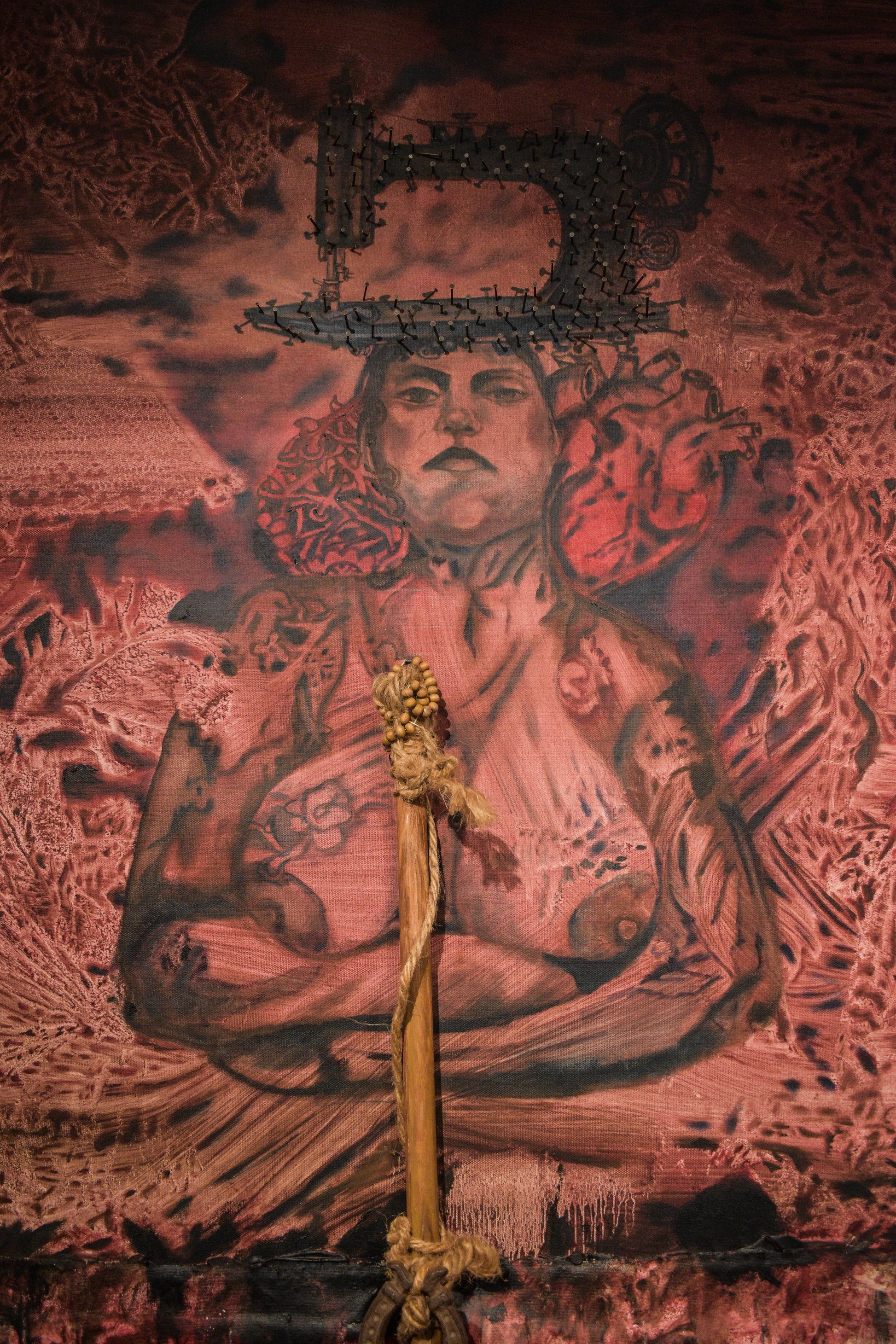 Artistic depiction of a woman figure with intricate details and textures.