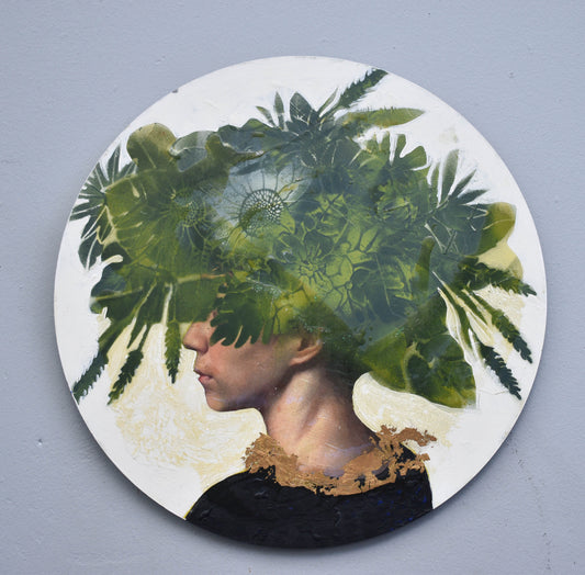 Circular artwork with a person's profile and green foliage overlay on a gray background