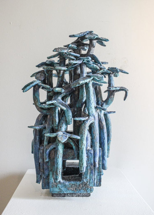 Ceramic piece of entangled trees on a steel base